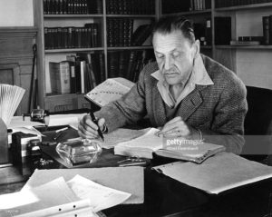 Author Somerset Maugham working on some pithy quotes for the internet
