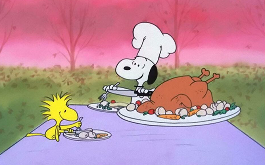 Woodstock and Snoopy split a Thanksgiving meal.